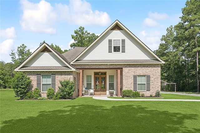 53131 S Bennett Rd, Independence, LA 70443 - view of front of property with french doors, brick siding, and a front lawn