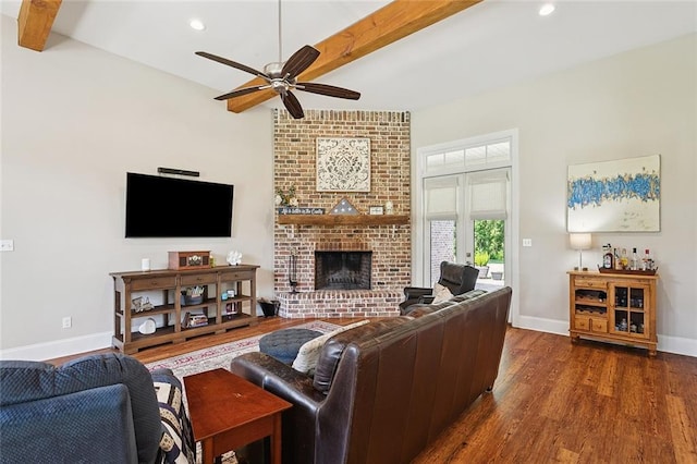 53131 S Bennett Rd, Independence, LA 70443 - living area with dark wood-style floors, beam ceiling, ceiling fan, a brick fireplace, and recessed lighting