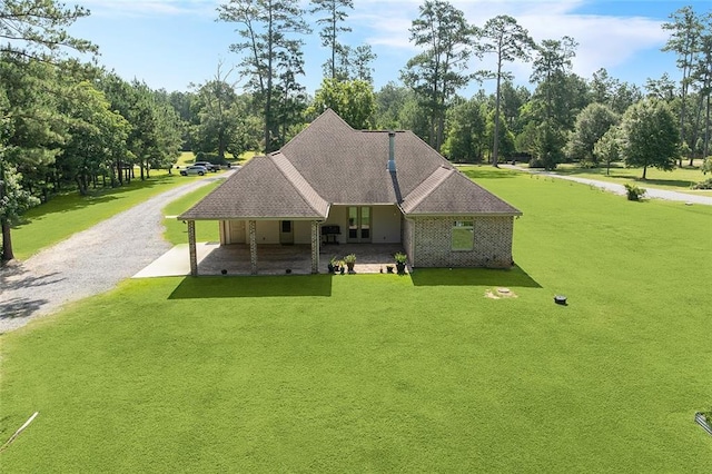 53131 S Bennett Rd, Independence, LA 70443 - view of front of property featuring driveway, a front yard, and view of wooded area