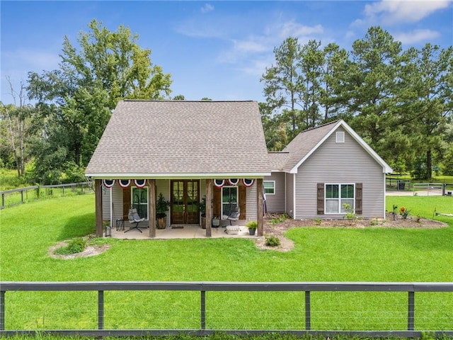 22101 Fletcher Rd, Ponchatoula, LA 70454 - view of front of house with a fenced backyard and french doors