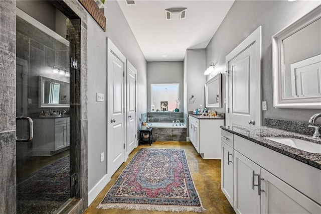22101 Fletcher Rd, Ponchatoula, LA 70454 - bathroom with two vanities, a garden tub, and a shower stall