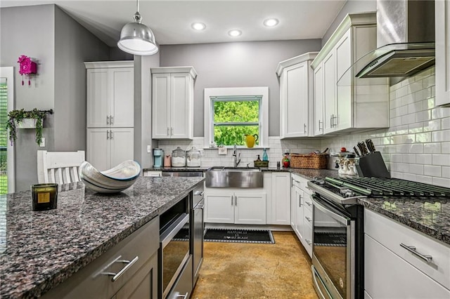 22101 Fletcher Rd, Ponchatoula, LA 70454 - kitchen featuring wall chimney exhaust hood, stainless steel range with gas cooktop, backsplash, white cabinets, and recessed lighting