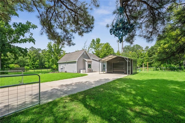 22101 Fletcher Rd, Ponchatoula, LA 70454 - garage with concrete driveway and a carport