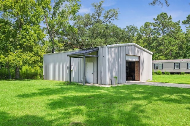 22101 Fletcher Rd, Ponchatoula, LA 70454 - view of outdoor structure featuring driveway