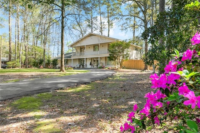 163 Tchefuncte Dr, Covington, LA 70433 - view of front of home featuring a balcony, a porch, and asphalt driveway