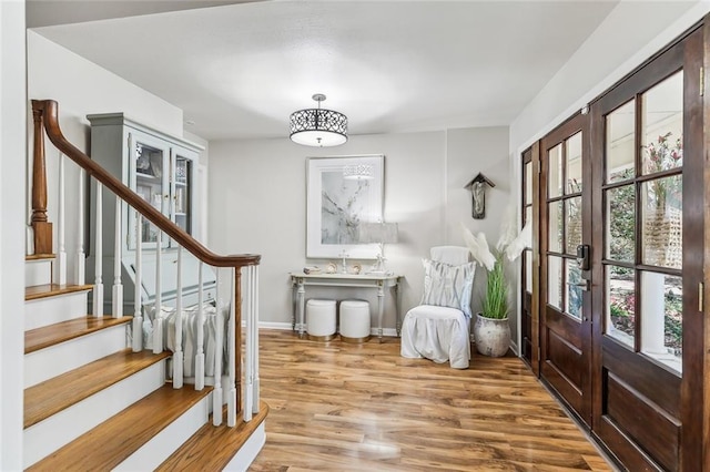 163 Tchefuncte Dr, Covington, LA 70433 - entrance foyer featuring french doors, stairs, and wood finished floors