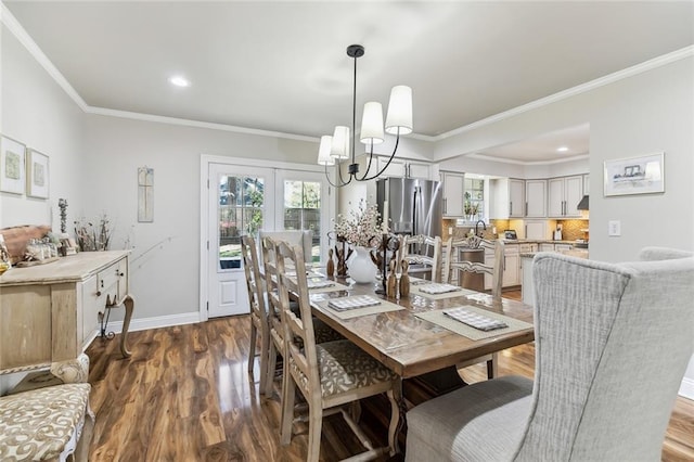 163 Tchefuncte Dr, Covington, LA 70433 - dining area featuring a chandelier, ornamental molding, dark wood-style floors, and recessed lighting