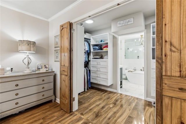 163 Tchefuncte Dr, Covington, LA 70433 - spacious closet featuring wood finished floors and a chandelier