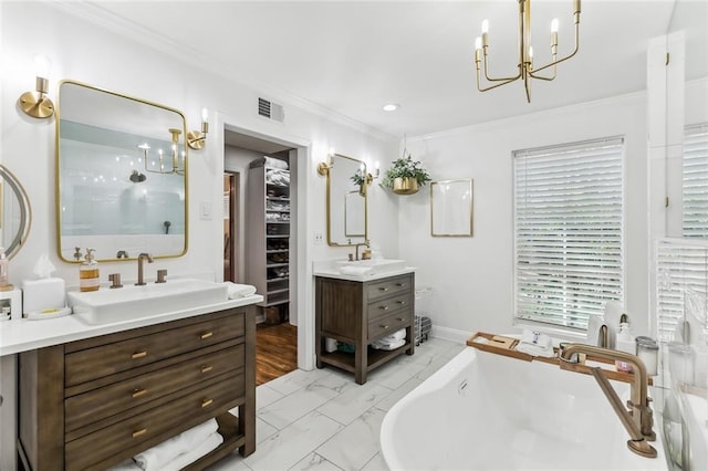 163 Tchefuncte Dr, Covington, LA 70433 - bathroom featuring a chandelier, a stall shower, marble finish flooring, two vanities, and a freestanding bath