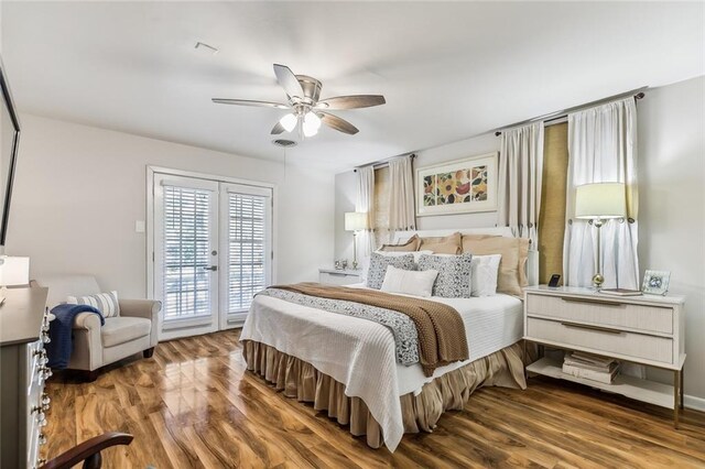 163 Tchefuncte Dr, Covington, LA 70433 - bedroom with access to exterior, french doors, wood finished floors, and a ceiling fan