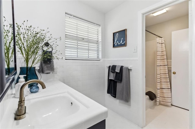 163 Tchefuncte Dr, Covington, LA 70433 - bathroom featuring tile walls, vanity, a wainscoted wall, and curtained shower
