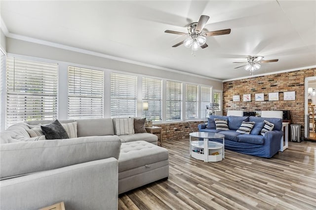 163 Tchefuncte Dr, Covington, LA 70433 - living room featuring brick wall, wood finished floors, ornamental molding, and a ceiling fan