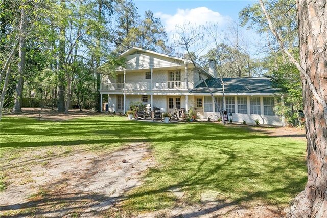 163 Tchefuncte Dr, Covington, LA 70433 - back of property featuring a yard, a patio, a chimney, and a balcony
