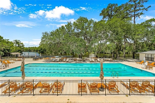 163 Tchefuncte Dr, Covington, LA 70433 - community pool featuring a patio area and view of wooded area