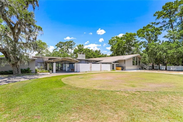 163 Tchefuncte Dr, Covington, LA 70433 - back of property with a chimney