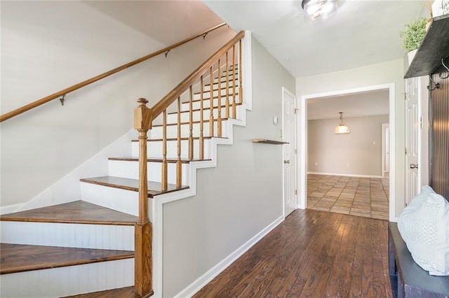 643 Stoney Creek Ave, Baton Rouge, LA 70808 - stairs featuring hardwood / wood-style flooring and baseboards