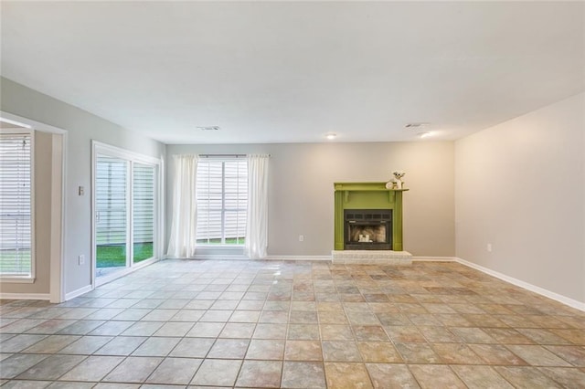 643 Stoney Creek Ave, Baton Rouge, LA 70808 - unfurnished living room featuring a brick fireplace and baseboards