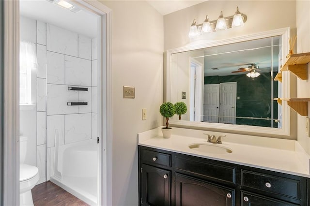 643 Stoney Creek Ave, Baton Rouge, LA 70808 - bathroom featuring vanity, ceiling fan, wood finished floors, and shower / washtub combination