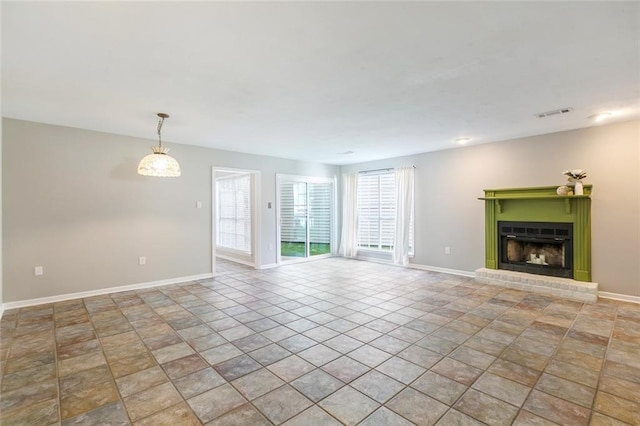 643 Stoney Creek Ave, Baton Rouge, LA 70808 - unfurnished living room with a fireplace and light stone finish floors