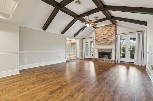 82 Melrose Dr, Destrehan, LA 70047 - unfurnished living room with french doors, wood finished floors, ceiling fan, and a fireplace