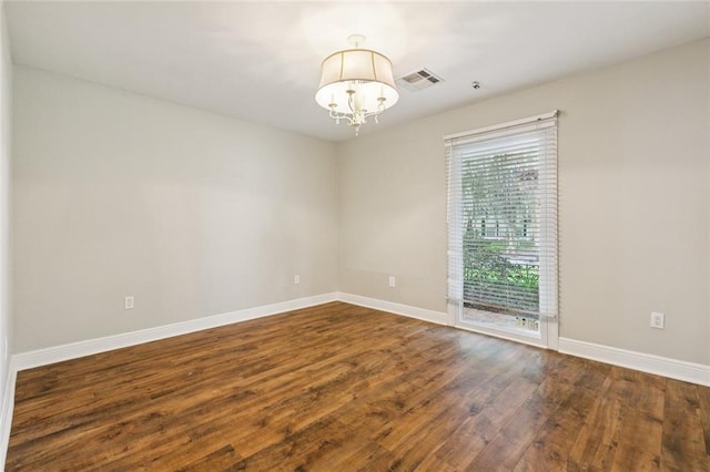 82 Melrose Dr, Destrehan, LA 70047 - empty room with a chandelier and wood finished floors