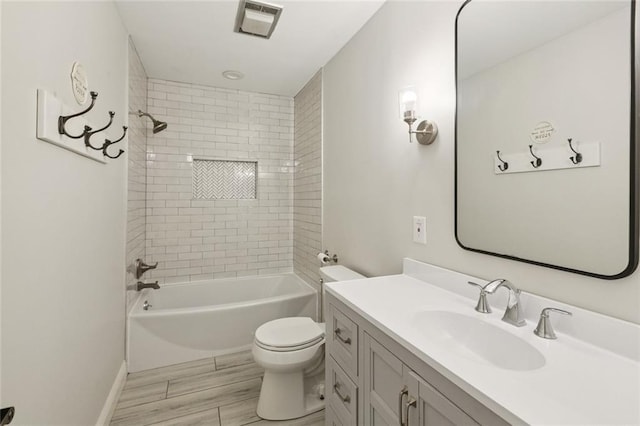 82 Melrose Dr, Destrehan, LA 70047 - bathroom featuring vanity, washtub / shower combination, and wood finished floors