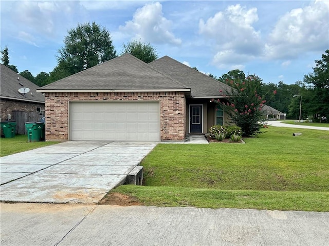 500 Buckthorne Pl, Covington, LA 70435 - ranch-style house with brick siding, an attached garage, a front lawn, driveway, and a shingled roof