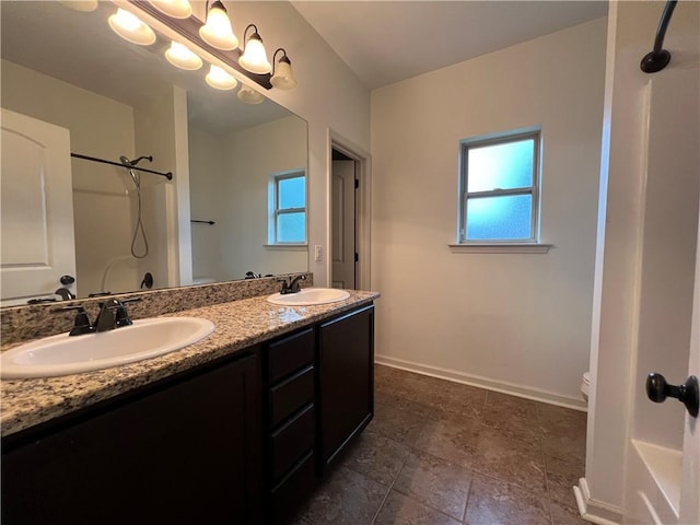 500 Buckthorne Pl, Covington, LA 70435 - full bathroom featuring a shower, double vanity, and plenty of natural light