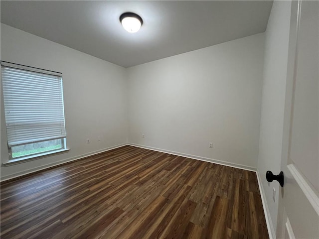 500 Buckthorne Pl, Covington, LA 70435 - unfurnished room with dark wood-type flooring and baseboards