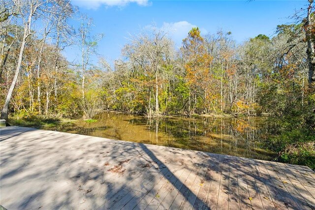 4233 Cypress Point Dr, Covington, LA 70433 - deck featuring a wooded view