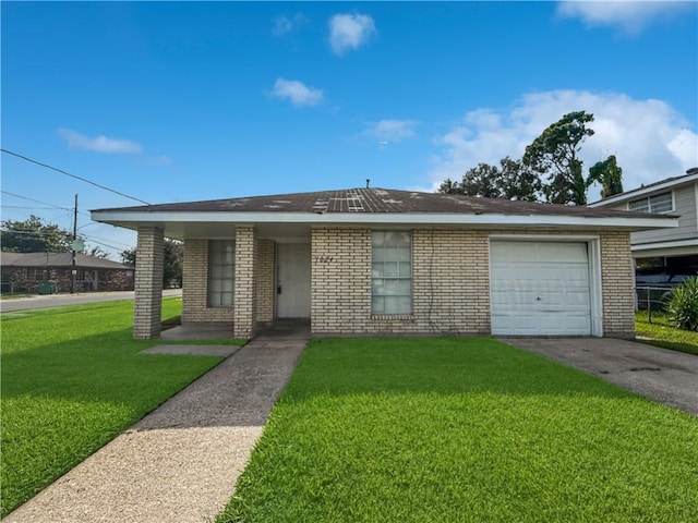 1024 Marshall Dr, Marrero, LA 70072 - view of front facade featuring brick siding, a front yard, and driveway