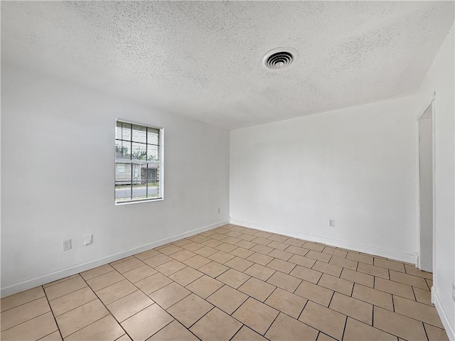 1024 Marshall Dr, Marrero, LA 70072 - spare room featuring a textured ceiling and baseboards