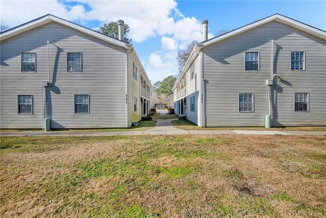 721 Heavens Dr Unit 6, Mandeville, LA 70471 - rear view of property with a yard