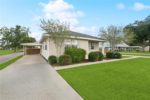 143 Vans Ln, Destrehan, LA 70047 - view of front of property featuring a front lawn, concrete driveway, and a carport