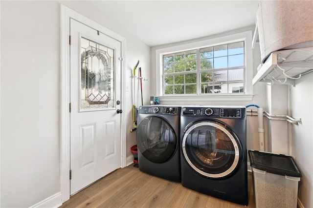 143 Vans Ln, Destrehan, LA 70047 - laundry room featuring washing machine and clothes dryer and wood finished floors