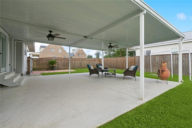 143 Vans Ln, Destrehan, LA 70047 - fenced backyard featuring a ceiling fan, entry steps, and a patio