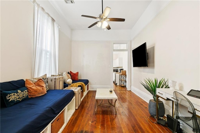 332426 Banks St, New Orleans, LA 70119 - living area featuring dark wood-style flooring and a ceiling fan