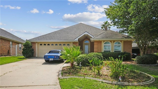 213 Chimaera Ln, Slidell, LA 70458 - view of front of home with concrete driveway, an attached garage, roof with shingles, and stucco siding