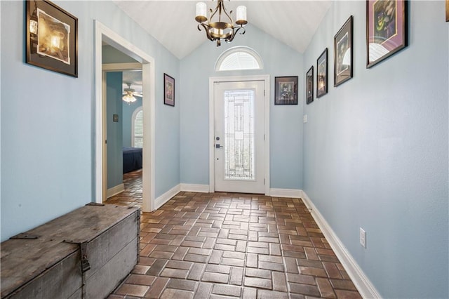 213 Chimaera Ln, Slidell, LA 70458 - entrance foyer with brick flooring, a chandelier, vaulted ceiling, and ceiling fan