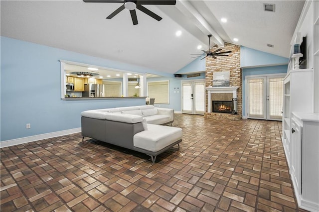 213 Chimaera Ln, Slidell, LA 70458 - living area with a ceiling fan, a fireplace, brick flooring, beamed ceiling, and french doors