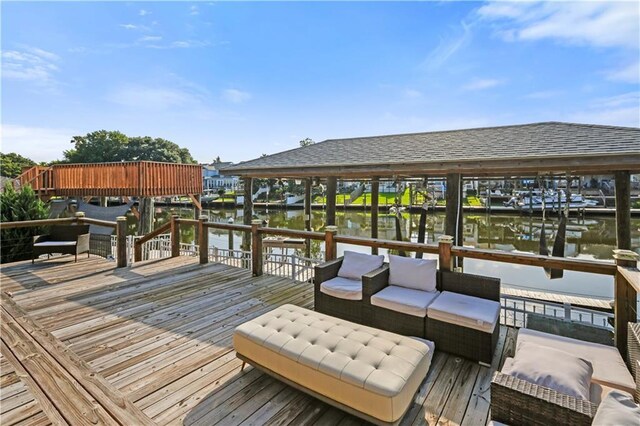 213 Chimaera Ln, Slidell, LA 70458 - wooden deck with a water view, boat lift, a boat dock, and an outdoor living space