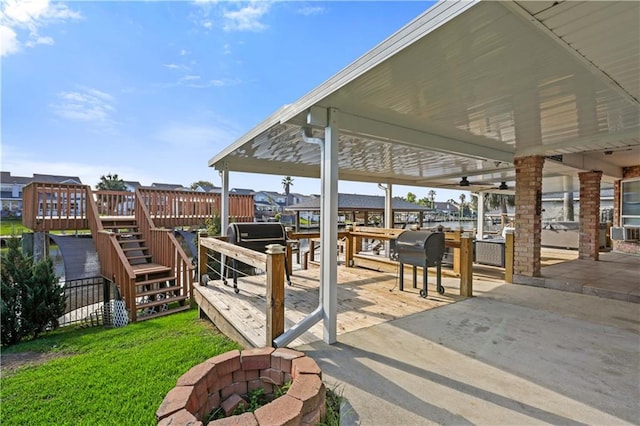 213 Chimaera Ln, Slidell, LA 70458 - view of patio with a fire pit, a deck, and stairway