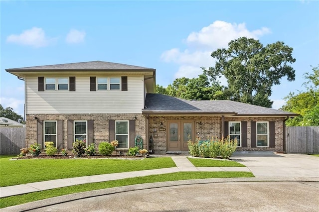5924 Bellingham Pl, Metairie, LA 70003 - view of front of home with brick siding, french doors, and concrete driveway