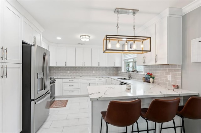 5924 Bellingham Pl, Metairie, LA 70003 - kitchen featuring stainless steel fridge with ice dispenser, a peninsula, white cabinetry, decorative backsplash, and light stone countertops