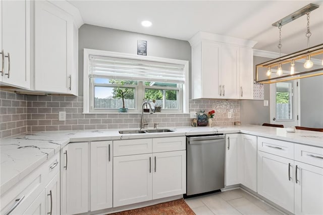 5924 Bellingham Pl, Metairie, LA 70003 - kitchen featuring stainless steel dishwasher, white cabinetry, backsplash, and plenty of natural light