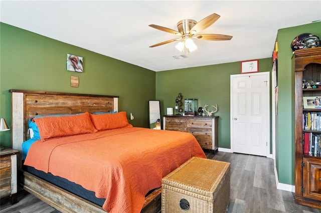 5924 Bellingham Pl, Metairie, LA 70003 - bedroom featuring dark wood-style flooring and a ceiling fan