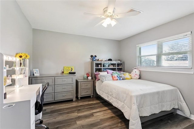 5924 Bellingham Pl, Metairie, LA 70003 - bedroom with dark wood finished floors, an office area, and a ceiling fan