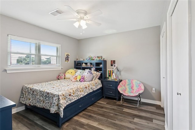 5924 Bellingham Pl, Metairie, LA 70003 - bedroom with dark wood-style floors and a ceiling fan