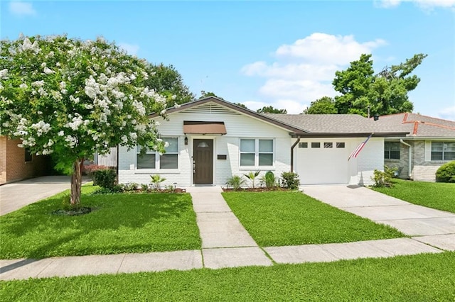 1112 Kent Ave, Metairie, LA 70001 - single story home with an attached garage, a front lawn, concrete driveway, and brick siding