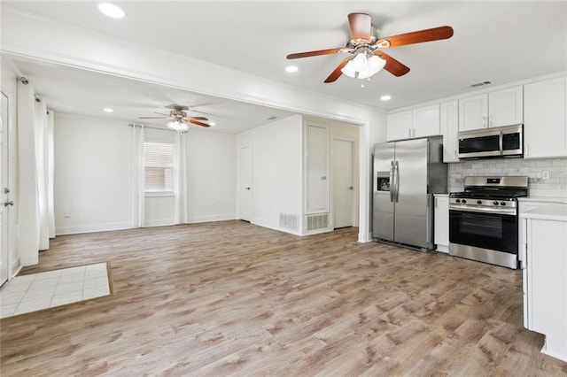 1112 Kent Ave, Metairie, LA 70001 - kitchen with appliances with stainless steel finishes, ceiling fan, backsplash, recessed lighting, and light countertops
